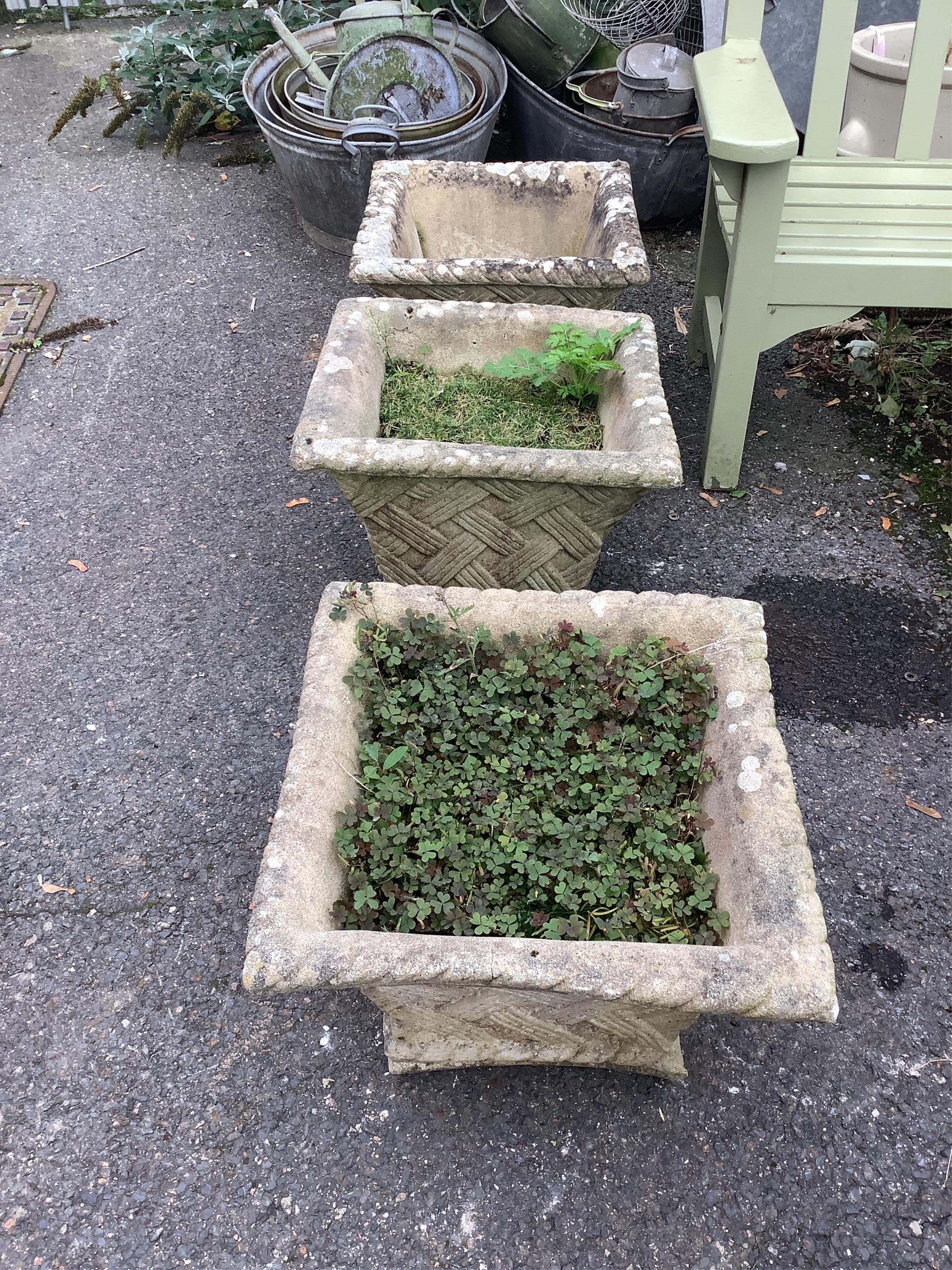 A set of three reconstituted stone square garden planters, 48cm, height 38cm. Condition - fair